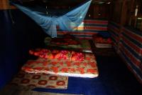 The simple homestay bedroom and kitchen for Workawayers at this village school